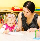 teacher helping her pupil